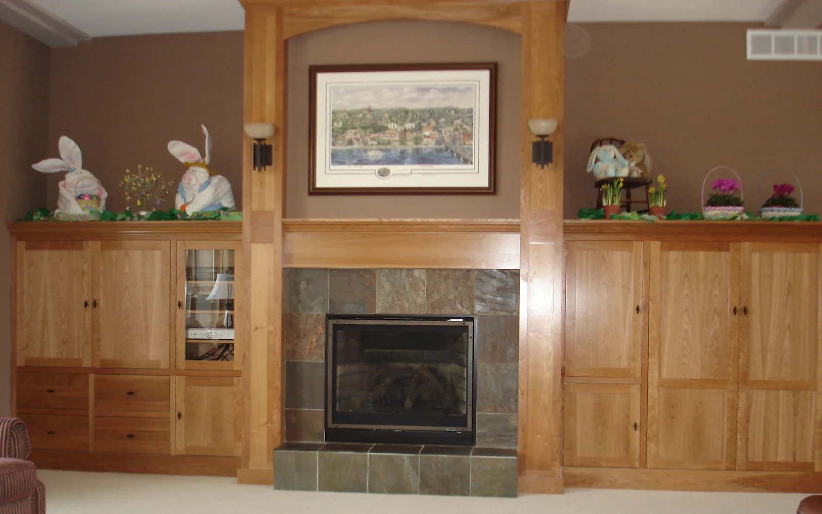 Custom fireplace surround and media built-in with craftsman-style columns